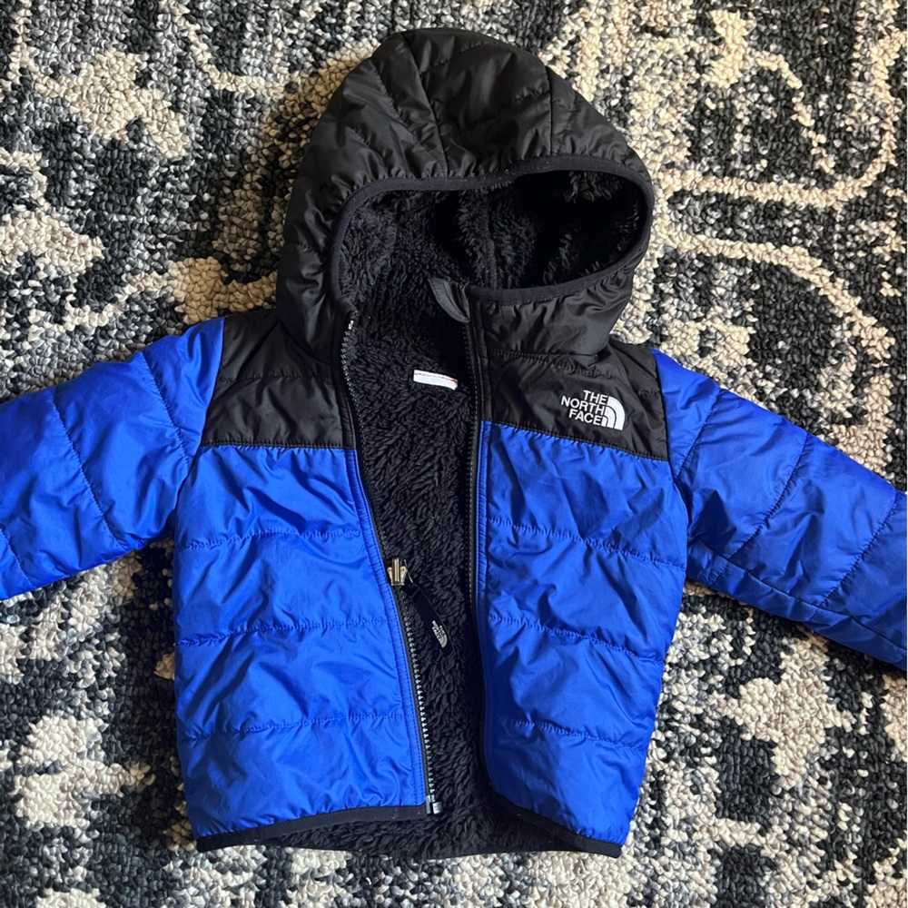 The North Face baby reversible fleece puffer jacket.